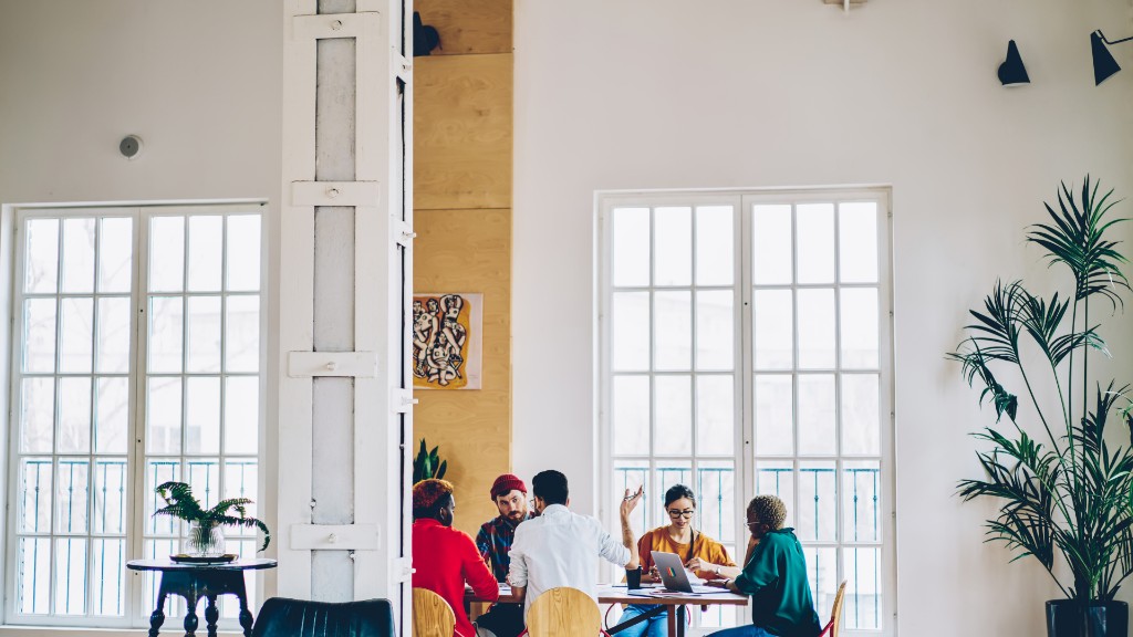 Product team collaborating around a table in a bright office